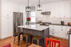 Transitional kitchen remodel - cottage style white kitchen. Remodel features added work space, island, custom cabinetry and reclaimed wood to add a contemporary pop.