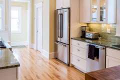 Empty-Nesters’ Kenwood, Minneapolis kitchen remodel - near Lake of the Isles. Contemporary floor plan in traditional space. Features powder room addition