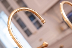 Gold sink faucet , detail image, part of tradiitonal style kitchen addition remodeling project photo gallery.