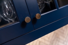 Deep blue cabinetry knob close-up , detail image, part of tradiitonal style kitchen addition remodeling project photo gallery.    
