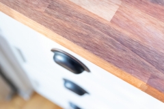 Drawer handle close-up ; part of transitional design kitchen remodel in Minneapolis 4-square home.   Features  modern textures and colors, reused and recreated historical details, colorful backsplash and kitchen island.
