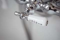 Shower handle close-up ; detail shot from bathroom remodeling project photo gallery.  Features