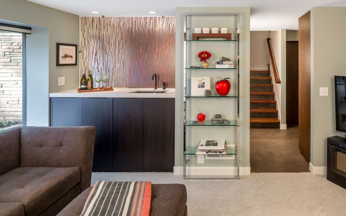 Sleek Mid-Century basement remodel.  Features modern materials and hand-crafted cabinetry.