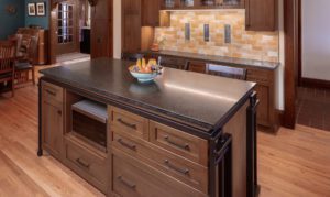 kitchen island with custom built in cabinetry and storage, including microwave space