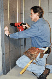 A man working on a basement remodel.