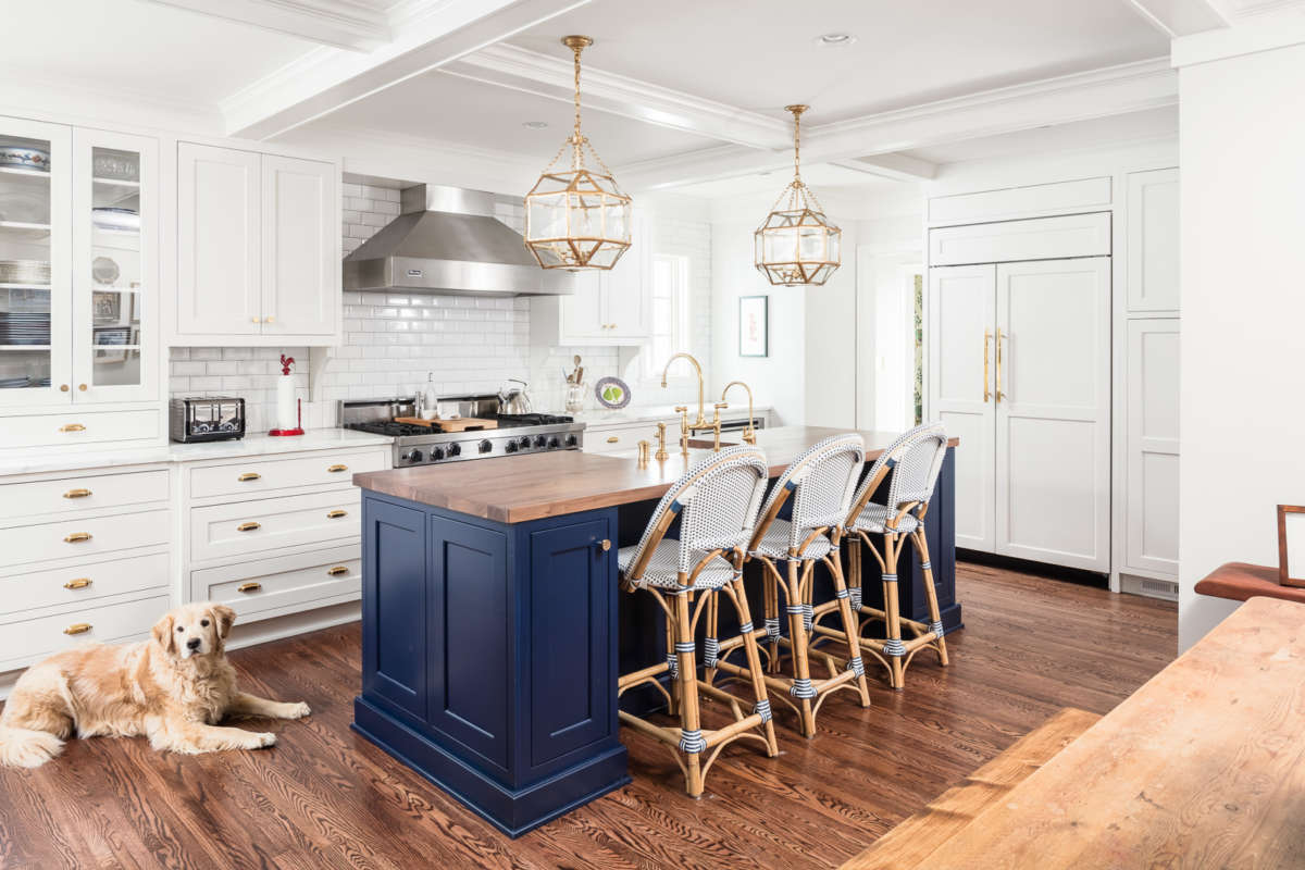 Luxury kitchen remodel and kitchen addition in colonial home. Traditional style, features island, butler's pantry, custom royal blue cabinetry and added family room.