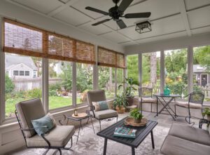 Screenporch addition - exterior view from backyard. Porch and paver patio. New screenporch features custom-sized screens and views of the entire backyard. 