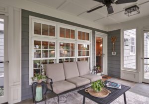 Screenporch addition - exterior view from backyard. Porch and paver patio. New screenporch features custom-sized screens and views of the entire backyard. 