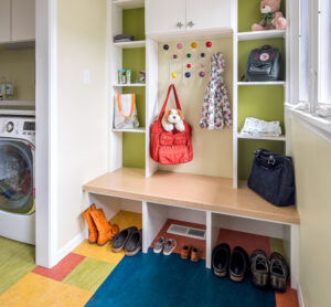 Colorful Laundry Room Brightens Every Day: Mudroom addition with laundry. Features eclectic style with patterned floor and upbeat palette.