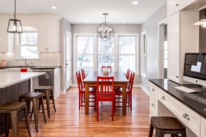 Transitional kitchen remodel - cottage style white kitchen. Remodel features added work space, island, custom cabinetry and reclaimed wood to add a contemporary pop. 