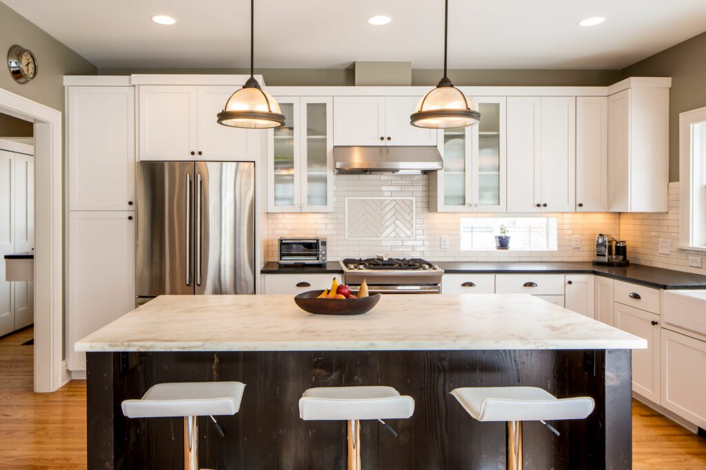 Minneapolis kitchen remodel with white cabinets and high quality oven and fridge.