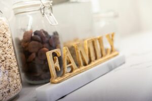 A wood carving of the word "family"