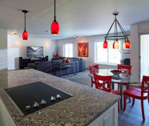 A condo remodel with red accents.