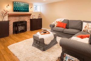 A basement remodel complete with a fireplace.