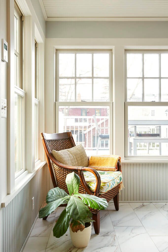 4 season screen porch remodel - chair seat in front of new windows