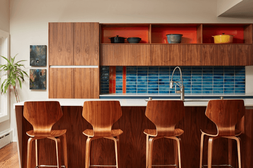 Kitchen remodel with blue tile backsplash.