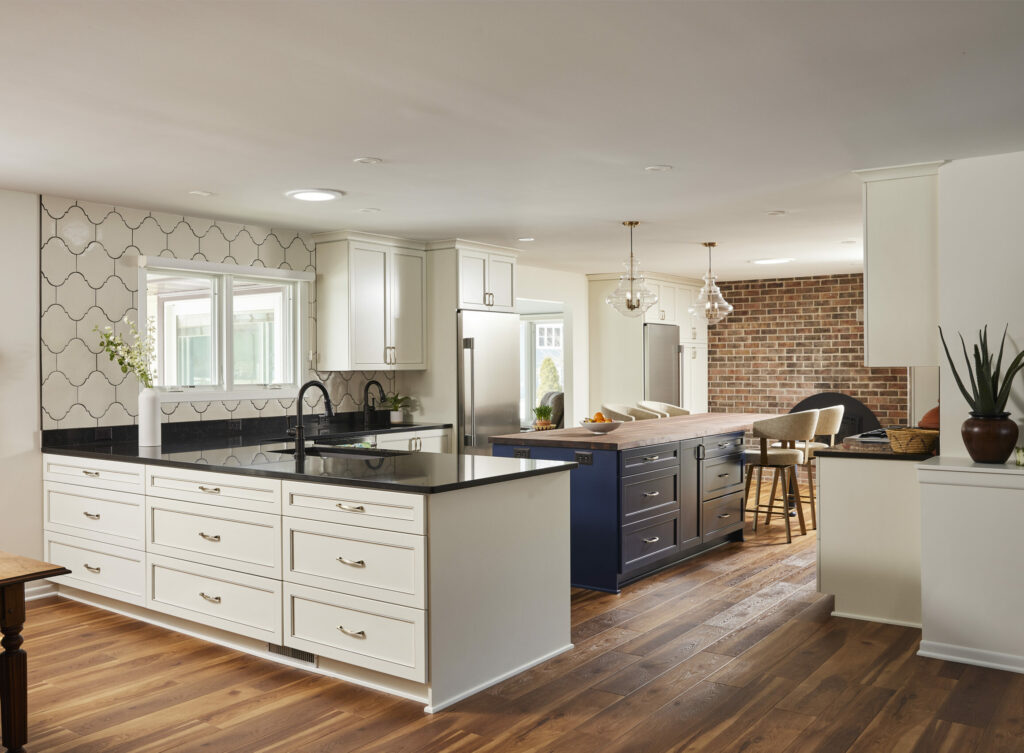 transitional Kitchen remodel in 80’s-era Ranch style rambler. View of island, looking out towards screenporch.