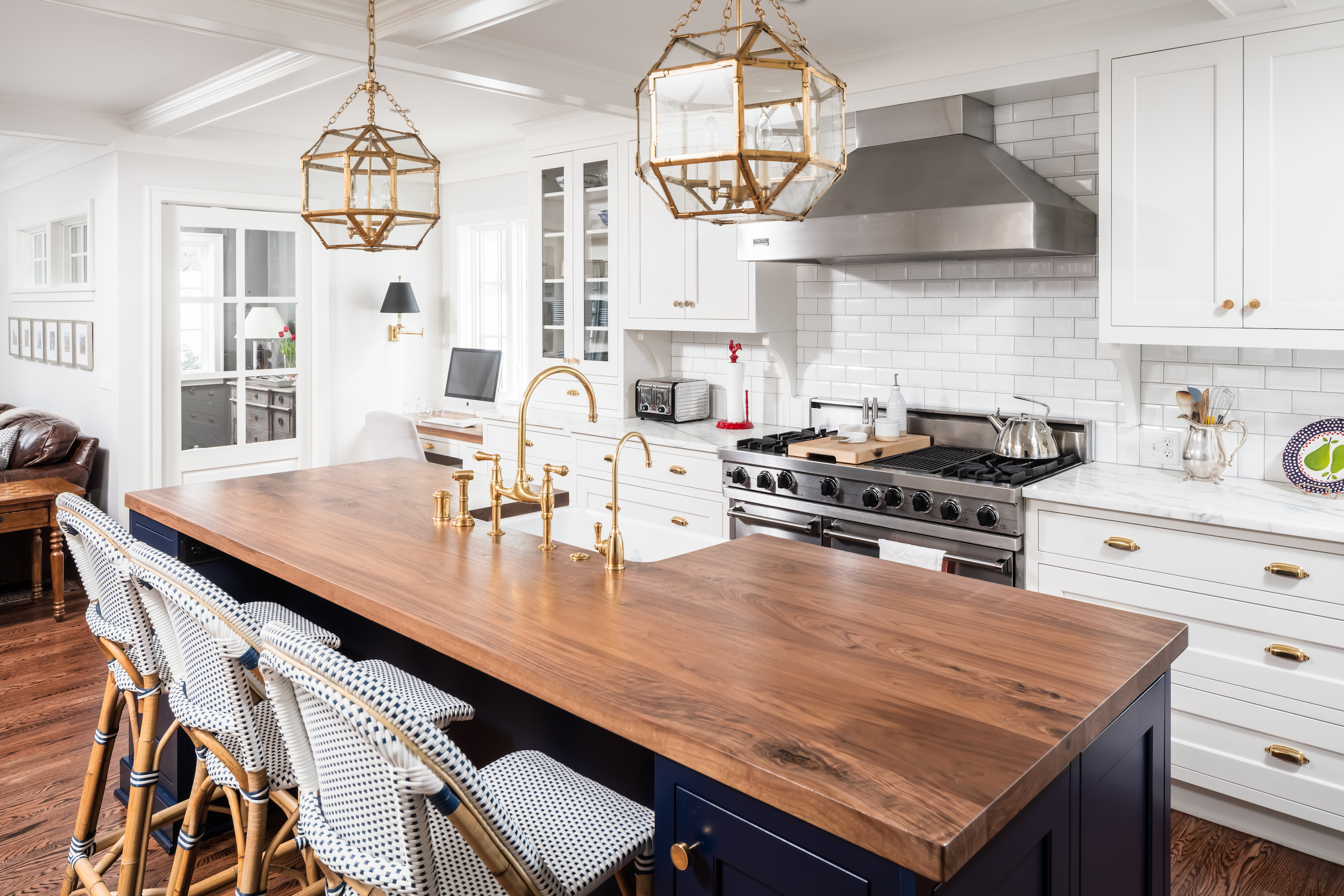 Luxury kitchen remodel and kitchen addition in colonial home. Traditional style, features island, butler's pantry, custom royal blue cabinetry and added family room.